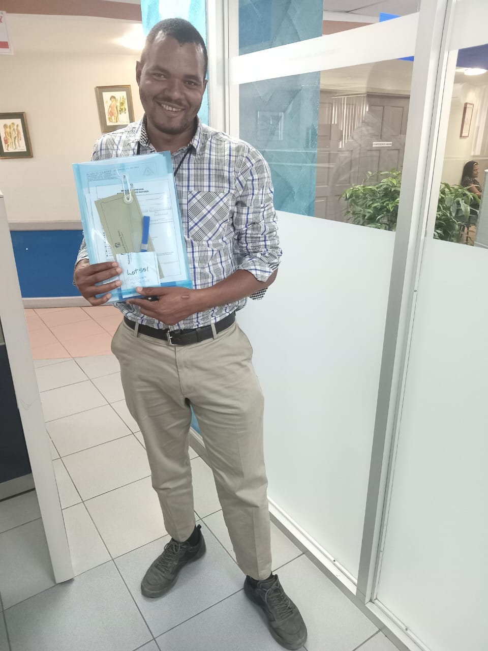 Tavaine Anglin collecting his documents at an office